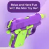100033-9c4961.webp Mini Toy Gun with Luminous Transparent Shell