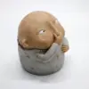 103197-ab00a2.webp Charming Resin Boy Nose-Plugging Sculpture