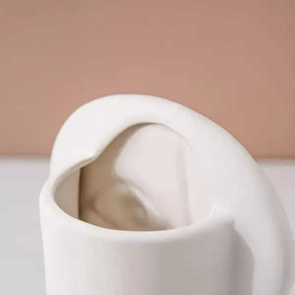 96492-2dacb4.webp Creative Nordic Ceramic Face Vase