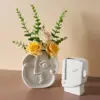 96492-e08a92.webp Creative Nordic Ceramic Face Vase