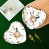 96869-bb4f55.webp Charming Heart-Shaped Ceramic Plate for Romantic Dining & Dessert Presentation