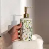 97906-51a2fe.webp Elegant Ceramic Flower Soap Dispenser