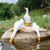 98080-2e6b30.webp Charming Duck Figurine Sculptures for Home and Garden Decor