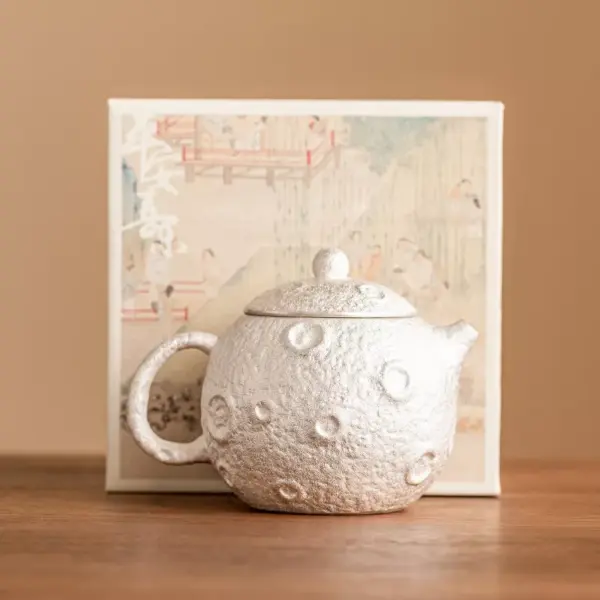 98669-68b6b9.webp Gilded Silver Ceramic Teapot
