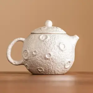 98669-ca4f8b.webp Gilded Silver Ceramic Teapot