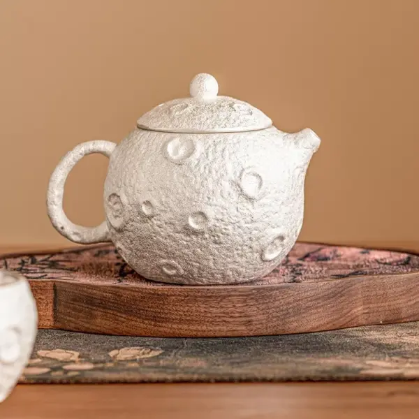 98669-eab95e.webp Gilded Silver Ceramic Teapot