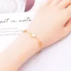 105747-69de4c.webp Heart Charm Stainless Steel Bracelet with Natural Seashell Embeds for Women