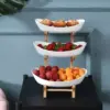 106406-4fa349.webp Multi-Layer Fruit and Snack Organizer: Elegant Oval Shaped Kitchen Stand