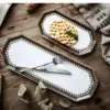 106446-bca6ef.webp Kitchen Storage Tray: Nordic Light Luxury Ceramic Plate Organizer