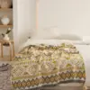 107053-46d35b.webp Bohemian Geometric Knitted Blanket
