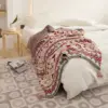 107053-fde501.webp Bohemian Geometric Knitted Blanket