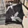 107055-00dac4.webp Elegant Black Crane & Floral Japanese Knitted Cotton Blanket