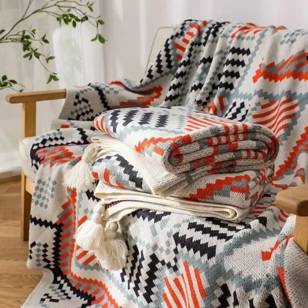 107059-5daf6d.webp Bohemian Nordic Knitted Blanket