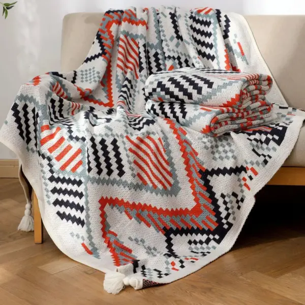 107059-d0dcdb.webp Bohemian Nordic Knitted Blanket