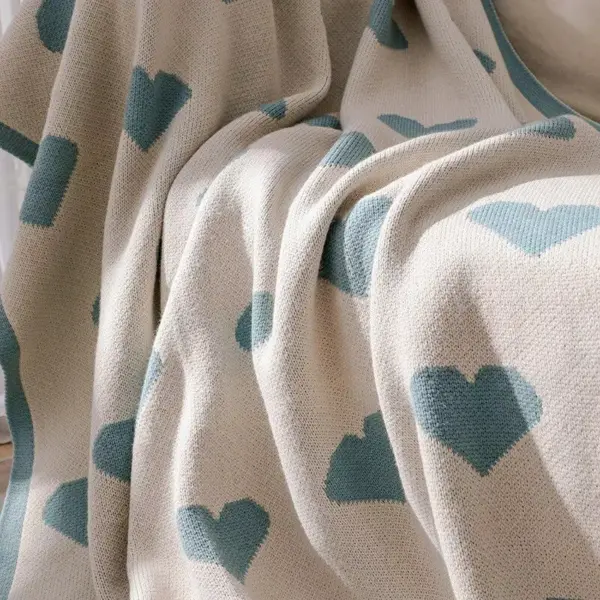 107060-27f7b7.webp Cozy Knitted Love Sofa Blanket
