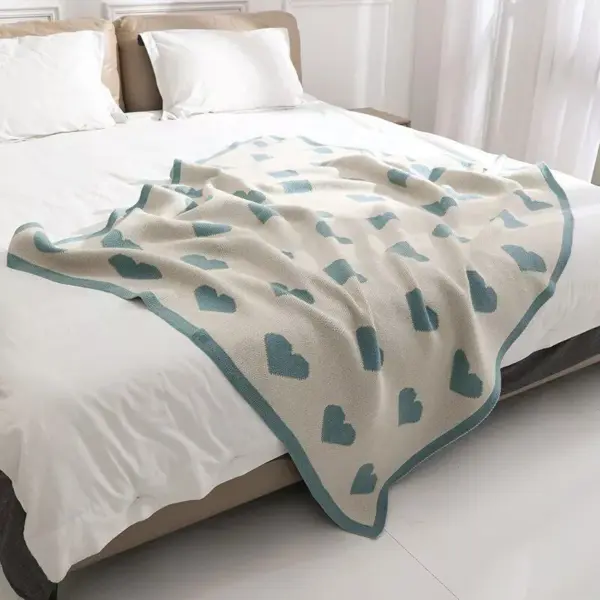 107060-f6e2f0.webp Cozy Knitted Love Sofa Blanket