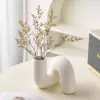 107459-f9ff1a.webp Contemporary Abstract Ceramic Vase
