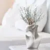 107504-e18125.webp European Ceramic Face Vase