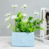 107507-890fe9.webp Chic Ceramic Handbag Vase
