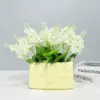 107507-ba7fea.webp Chic Ceramic Handbag Vase